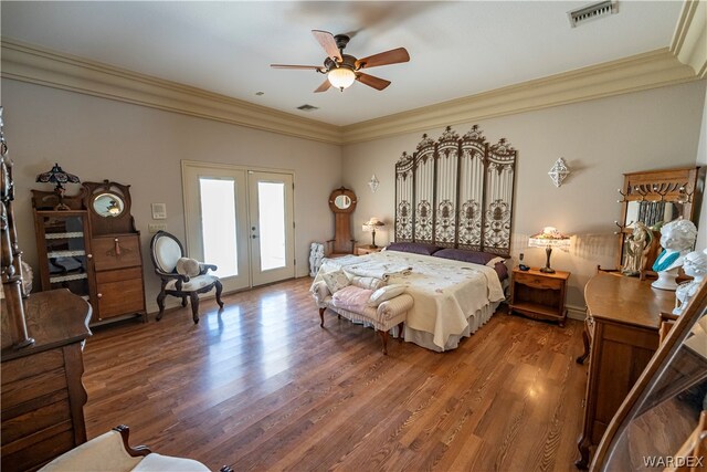 bedroom with access to exterior, visible vents, wood finished floors, and french doors