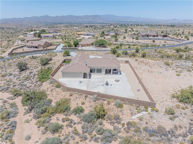 birds eye view of property with a residential view and a mountain view