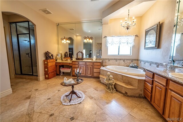 full bath featuring visible vents, a garden tub, an inviting chandelier, vanity, and a shower stall