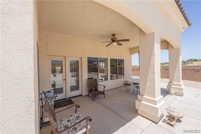 view of patio featuring a ceiling fan, french doors, and a fenced backyard