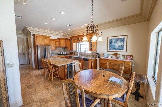 dining room with visible vents, ornamental molding, and recessed lighting