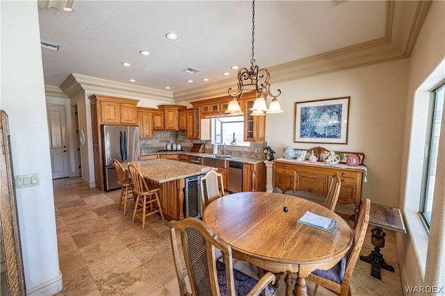 dining room with visible vents, ornamental molding, and recessed lighting