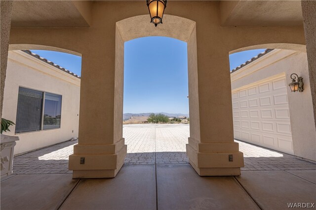 view of patio / terrace featuring a mountain view