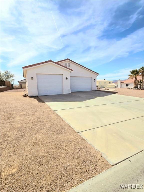 exterior space with concrete driveway