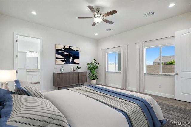 carpeted bedroom with multiple windows, recessed lighting, visible vents, and baseboards