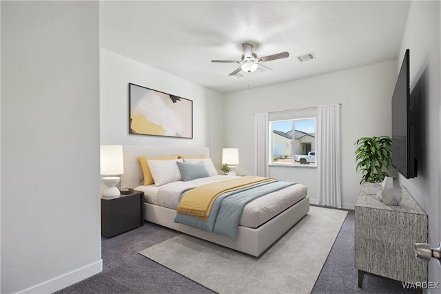 bedroom featuring baseboards, visible vents, dark colored carpet, and a ceiling fan