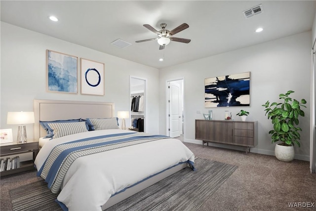 carpeted bedroom featuring recessed lighting, a ceiling fan, baseboards, visible vents, and a spacious closet