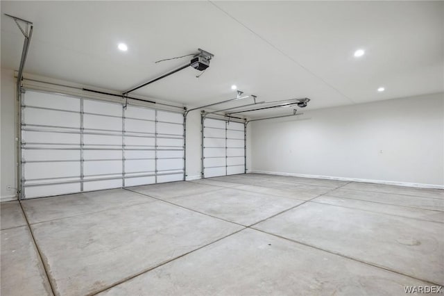 garage featuring a garage door opener, recessed lighting, and baseboards