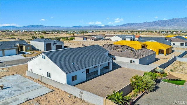 drone / aerial view featuring a residential view and a mountain view