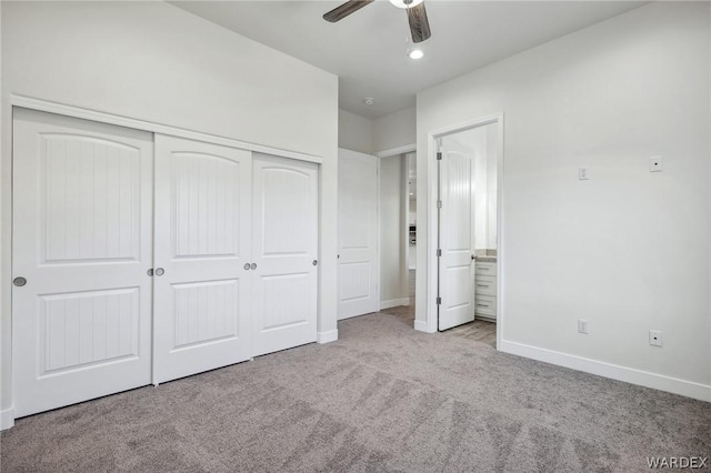 unfurnished bedroom featuring light carpet, a closet, a ceiling fan, and baseboards