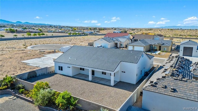 birds eye view of property with a residential view and a mountain view