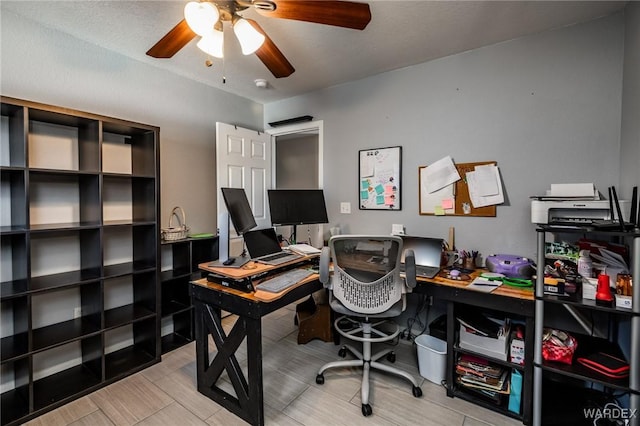 office space with a ceiling fan