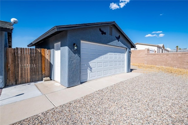 garage with fence