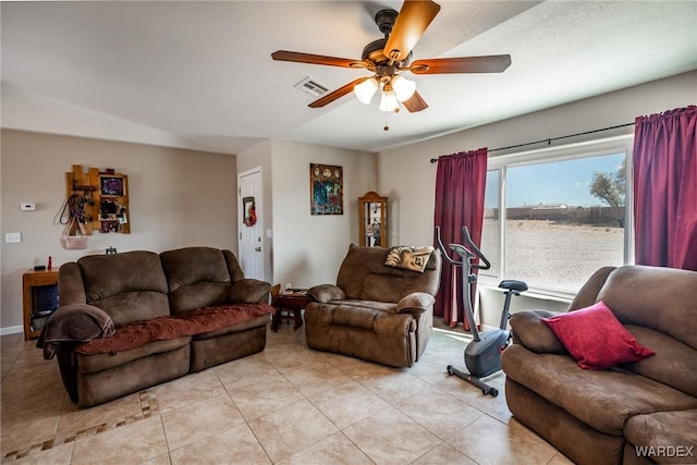 living room featuring visible vents, ceiling fan, and light tile patterned floors