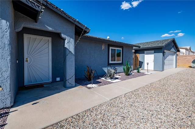 doorway to property featuring stucco siding