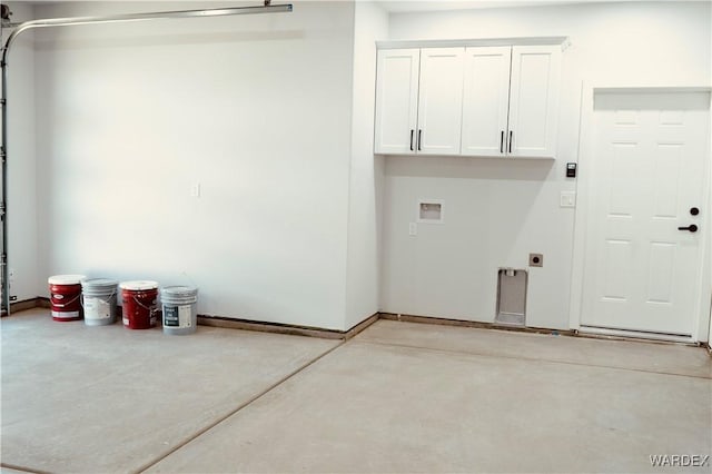 laundry room featuring hookup for a washing machine, hookup for an electric dryer, cabinet space, and a garage