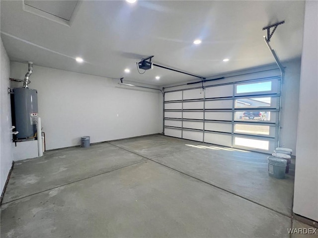 garage featuring water heater and a garage door opener