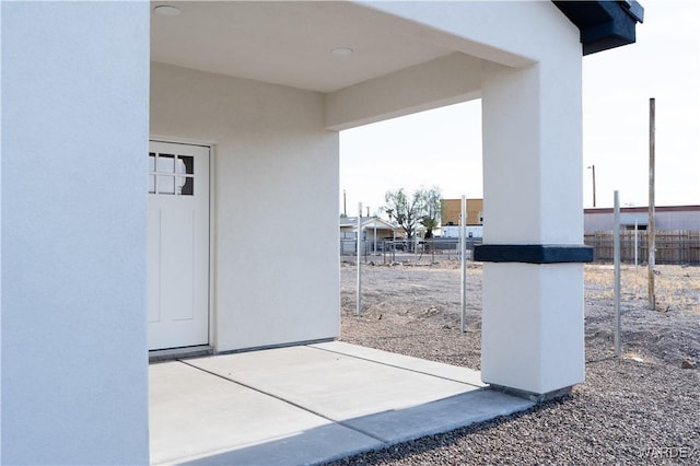 view of patio featuring fence