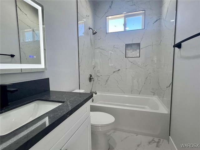 full bathroom with toilet, marble finish floor, tub / shower combination, and vanity