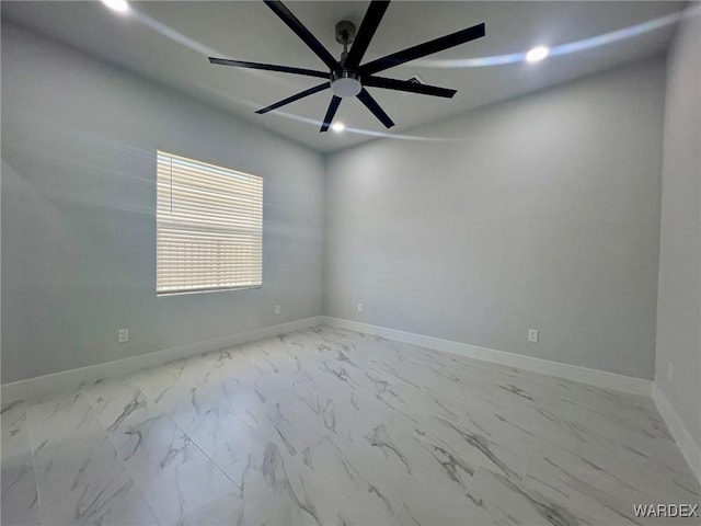 unfurnished room with marble finish floor, ceiling fan, baseboards, and recessed lighting