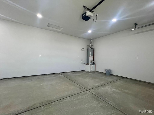 garage with water heater, recessed lighting, and a garage door opener