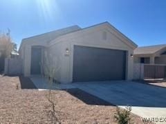 view of front of home with an attached garage and driveway