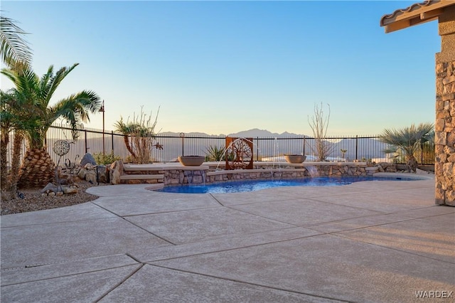 view of pool with a fenced in pool, a patio area, and a fenced backyard