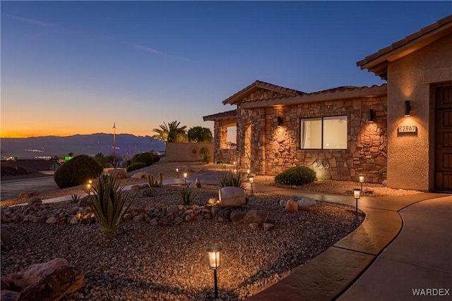 exterior space with stone siding