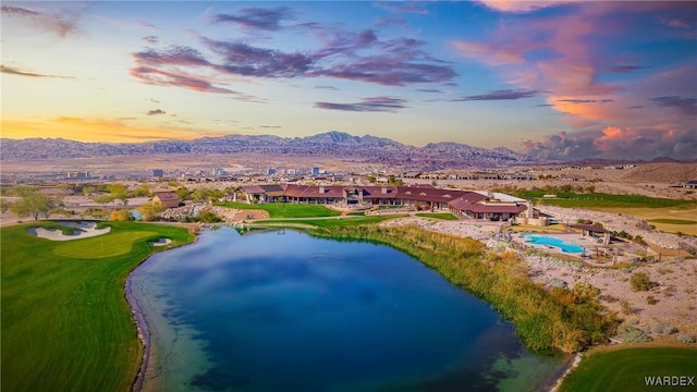 aerial view featuring a water and mountain view