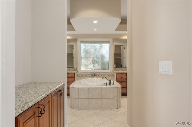 full bathroom with recessed lighting, a garden tub, vanity, and tile patterned floors