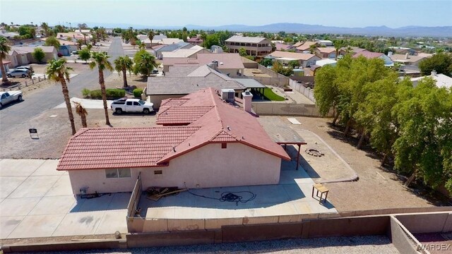 drone / aerial view with a residential view and a mountain view