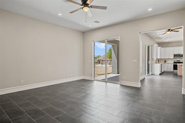 6068 S Greenhorn Dr, Fort Mohave, AZ 86426 - unfurnished room featuring a ceiling fan, baseboards, recessed lighting, and a sink