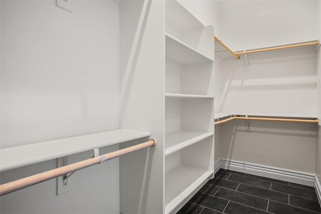 6068 S Greenhorn Dr, Fort Mohave, AZ 86426 - spacious closet with dark tile patterned floors