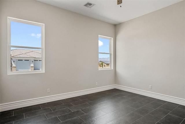 6068 S Greenhorn Dr, Fort Mohave, AZ 86426 - spare room featuring baseboards and ceiling fan