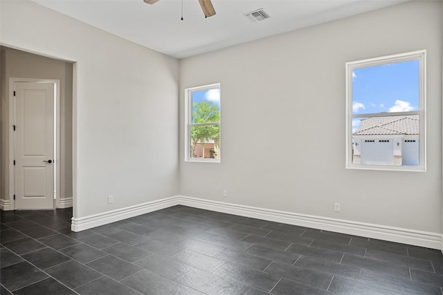 6068 S Greenhorn Dr, Fort Mohave, AZ 86426 - view of front of house with driveway, a garage, stucco siding, central AC, and a residential view