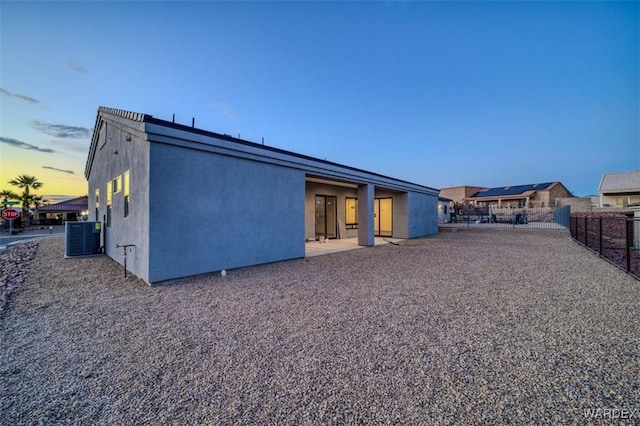 6068 S Greenhorn Dr, Fort Mohave, AZ 86426 - back of house with stucco siding and central AC unit