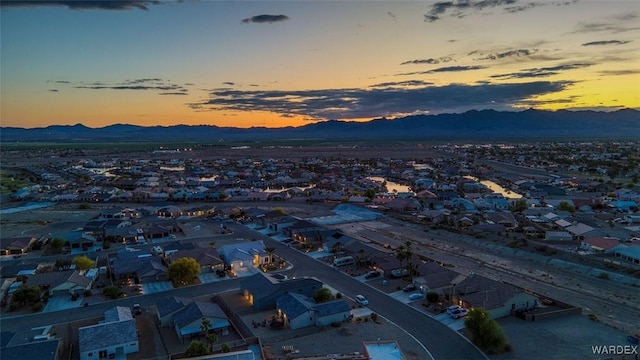 6068 S Greenhorn Dr, Fort Mohave, AZ 86426 - aerial view at dusk of a mountain view and a residential view