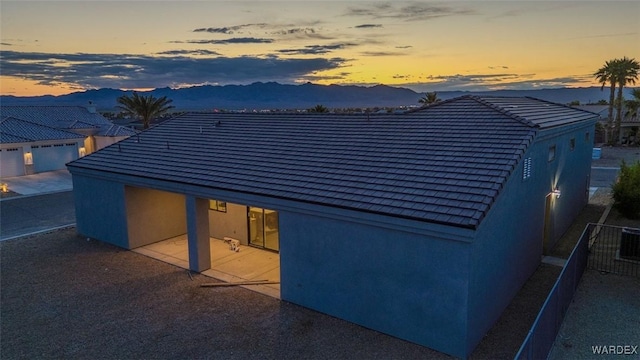 6068 S Greenhorn Dr, Fort Mohave, AZ 86426 - rear view of property featuring a mountain view and stucco siding