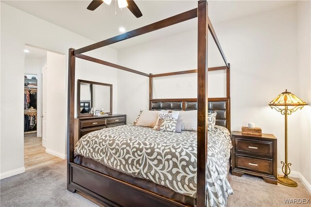 bedroom featuring baseboards and light colored carpet