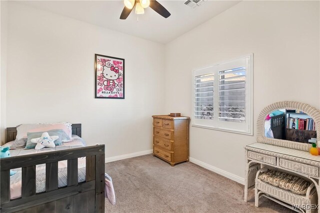 bedroom featuring light carpet, ceiling fan, visible vents, and baseboards