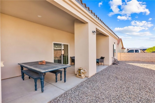 view of patio / terrace featuring outdoor dining area and fence