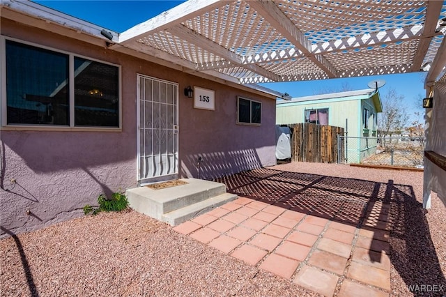 view of patio / terrace featuring fence