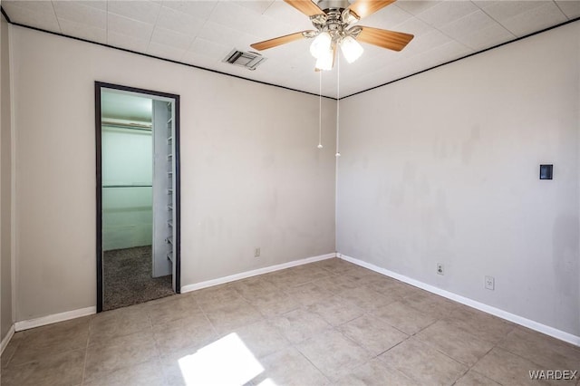 unfurnished bedroom with visible vents, baseboards, and a ceiling fan