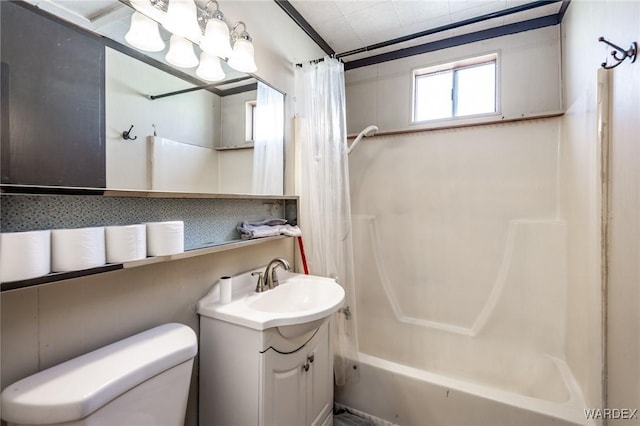 bathroom with toilet, vanity, and shower / bath combo