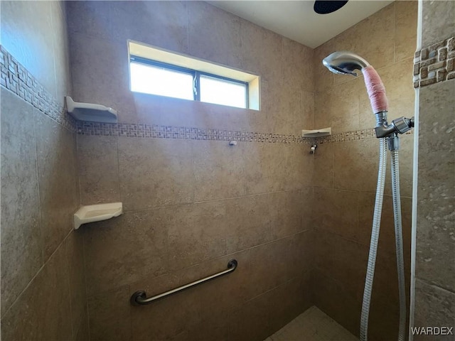 bathroom featuring a tile shower