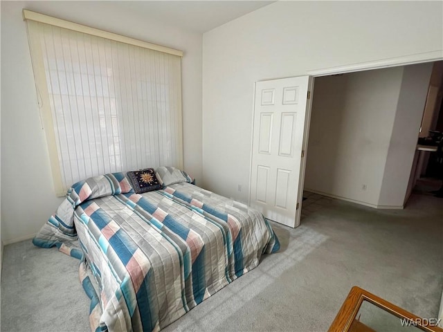 bedroom with light colored carpet