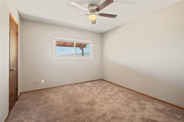 898 Crestwood Ln, Kingman, AZ 86409 - carpeted spare room with a textured ceiling and ceiling fan