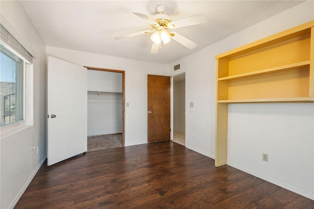898 Crestwood Ln, Kingman, AZ 86409 - unfurnished bedroom with wood finished floors and a ceiling fan