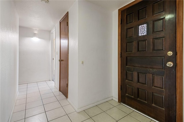 898 Crestwood Ln, Kingman, AZ 86409 - foyer entrance featuring light tile patterned floors and baseboards