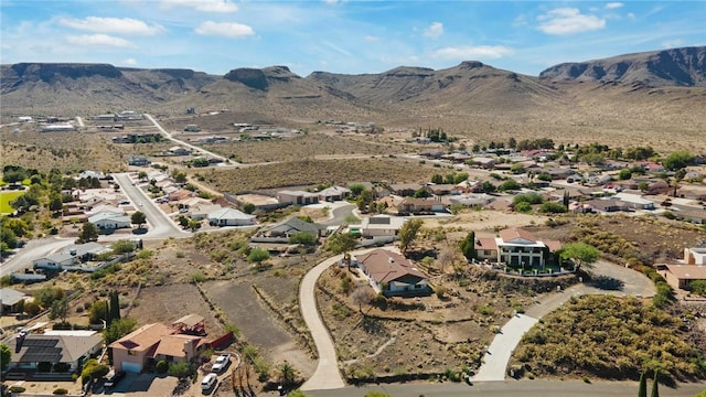 898 Crestwood Ln, Kingman, AZ 86409 - aerial overview of property's location featuring a mountain backdrop and nearby suburban area